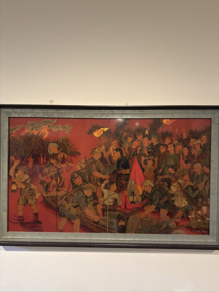 Large multi-panel painting at Vietnam National Museum of Fine Arts portraying community crossing river during revolution, female participants carrying flags and lanterns symbolizing collective resistance