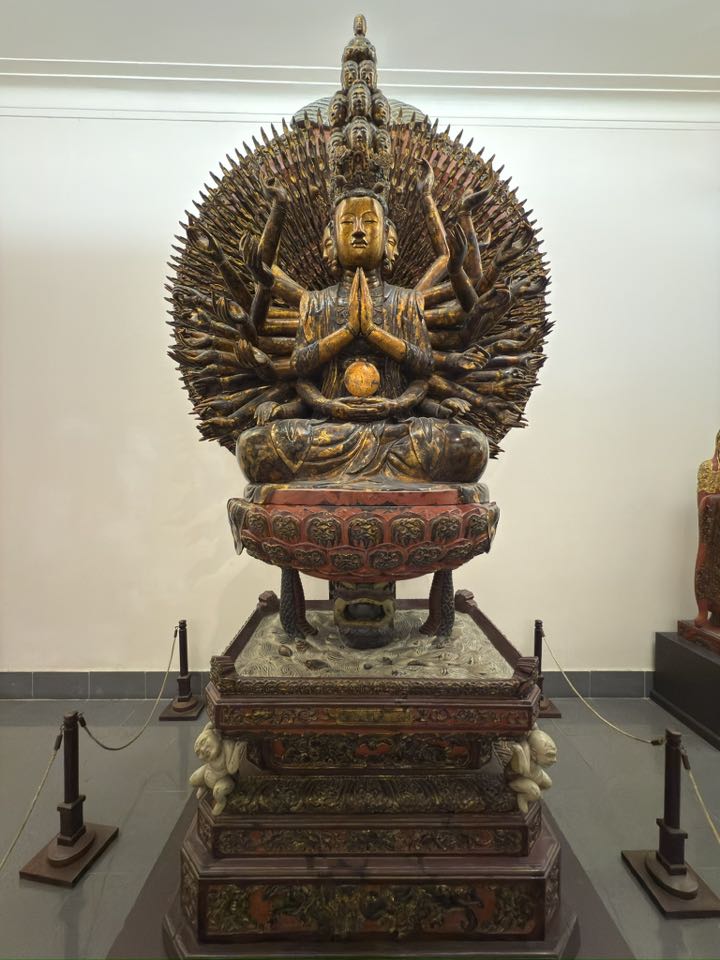 Front view of the second Avalokiteśvara sculpture in the Hanoi museum, indicating that Nāga-supported bodhisattva imagery appears more than once within the same institutional and cultural setting.