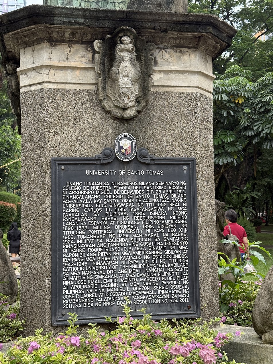 Historical marker at the University of Santo Tomas in the Philippines, showing the long continuity of Catholic education, colonial history, and institutional memory.