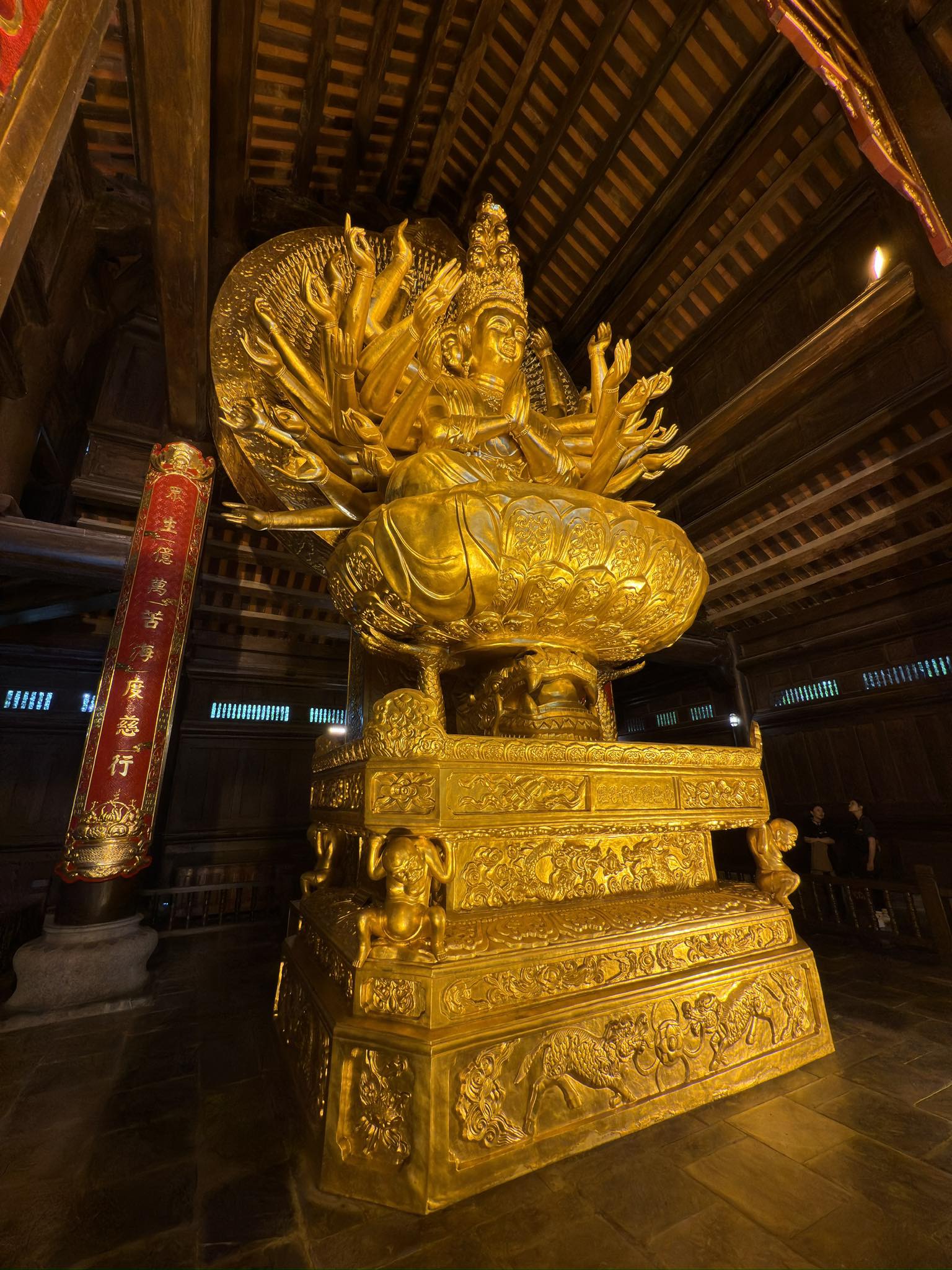 Gilded thousand-armed Avalokiteśvara in a Vietnamese temple, useful as a cross-site comparison showing how a locally grounded visual language of compassion continues beyond the museum context.